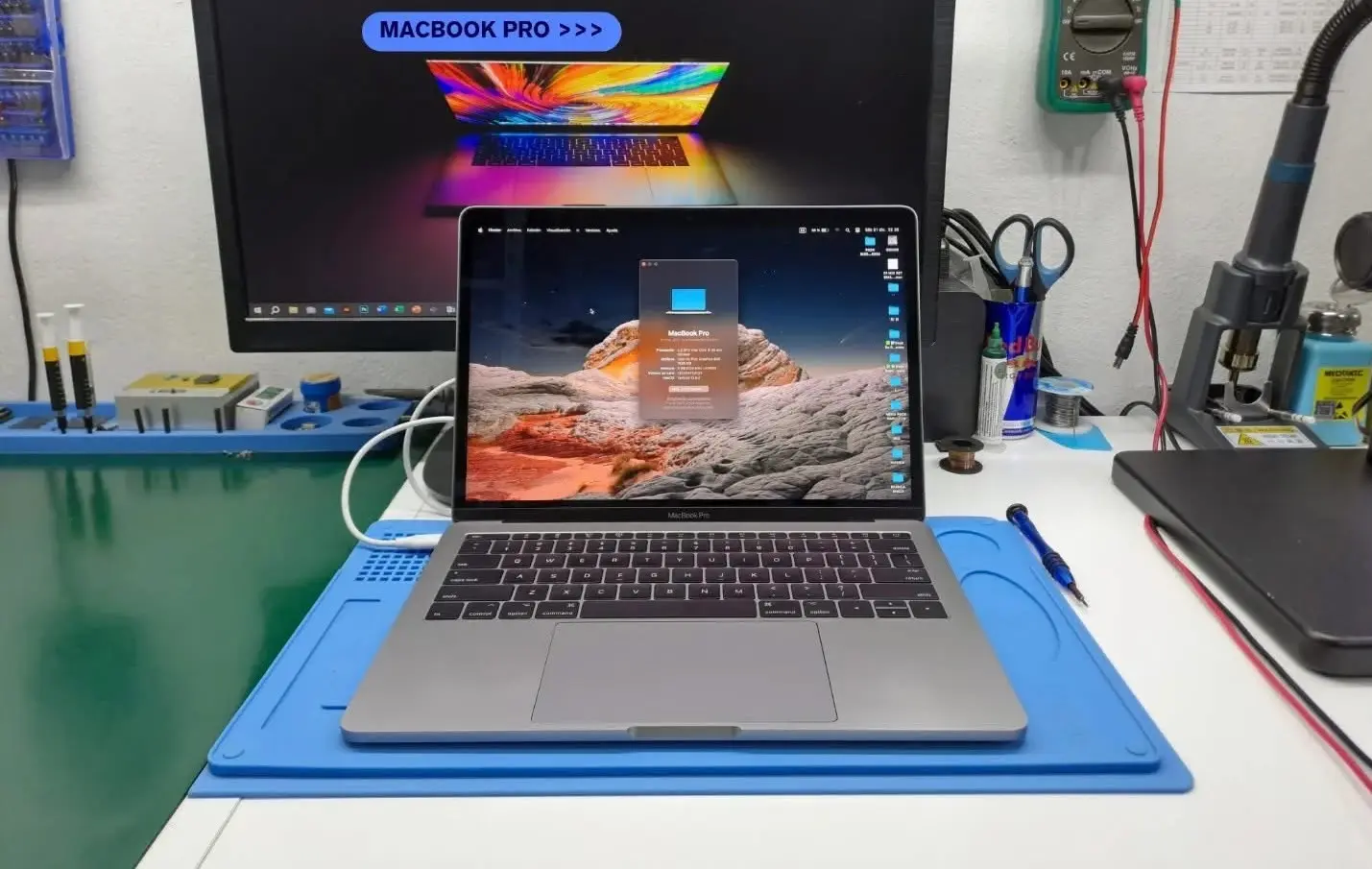 MacBook logic board micro-soldering under a microscope in Dubai — MacTech Pro board-level repair